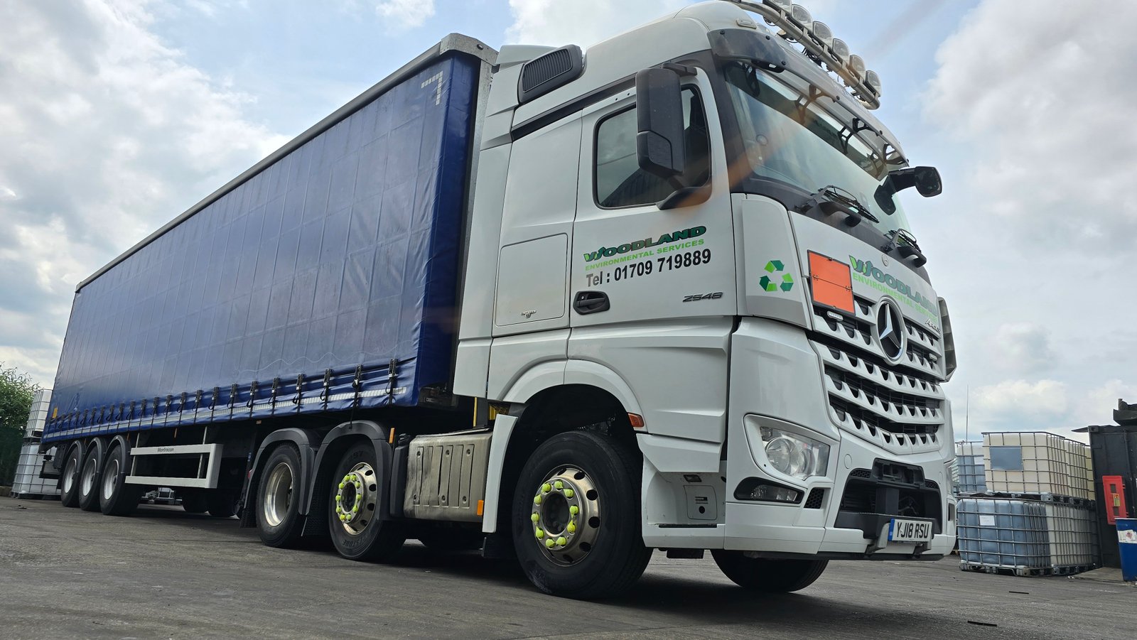 three quaters view of the woodland oil environmental services branded van